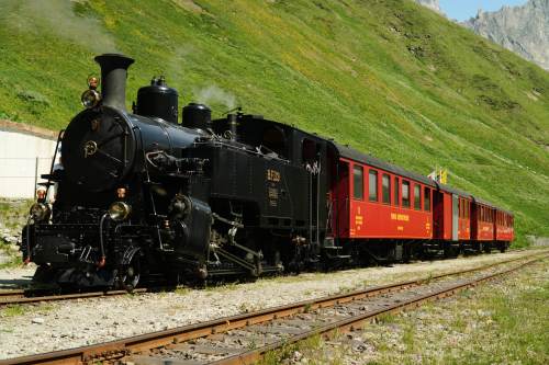One of DFB's historic steam trains travels from Realp to Oberwald during a stop at the Furka station, Switzerland, Friday, June 26, 2026. (AP Photo/Niccolo Lupone)