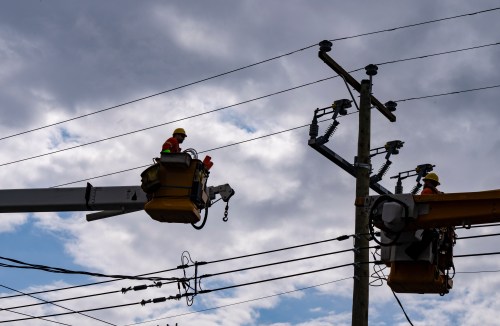 Quebec Hydro workers conduct maintenance on a residential hydro line in Montreal on Monday, May 4, 2026. THE CANADIAN PRESS/Christinne Muschi