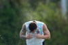 Argentina's Lionel Messi spalshes water on his head to cool down during a training session on the eve of the team's World Cup round of 32 soccer match against Cape Verde, Thursday, July 2, 2026, in Fort Lauderdale, Fla. (AP Photo/Rebecca Blackwell)