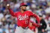 FILE - Cincinnati Reds starting pitcher Hunter Greene throws to a Los Angeles Dodgers batter during the first inning in Game 1 of the National League Wild Card baseball playoff series, Sept. 30, 2025, in Los Angeles. (AP Photo/Mark J. Terrill, File)