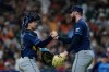 Tampa Bay Rays catcher Nick Fortes and pitcher Bryan Baker celebrate after a baseball game against the Houston Astros, Friday, July 3, 2026, in Houston. (AP Photo/Kevin M. Cox)