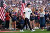 United States men's national soccer team head coach Mauricio Pochettino walks out to throw out the ceremonial first pitch before a baseball game between the Seattle Mariners and the Toronto Blue Jays, Friday, July 3, 2026, in Seattle. (AP Photo/Lindsey Wasson)