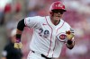 Cincinnati Reds' TJ Friedl runs to third base for a triple to score Jose Trevino during the second inning of a baseball game against the Baltimore Orioles in Cincinnati, Saturday, July 4, 2026. (AP Photo/Carolyn Kaster)