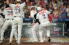 Houston Astros' Christian Vázquez dumps an ice chest on Houston Astros designated hitter Yordan Alvarez after he hit a walk-off home run during the ninth inning of a baseball game against the Tampa Bay Rays in Houston, Saturday, July 4, 2026. (AP Photo/Jon Shapley)