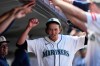 Teammates make a tunnel for Seattle Mariners starting pitcher Logan Gilbert to run through after he was relieved against the Toronto Blue Jays during the eighth inning of a baseball game, Saturday, July 4, 2026, in Seattle. (AP Photo/Lindsey Wasson)