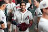Arizona Diamondbacks' Adrian del Castillo, center, celebrates with teammates after hitting a three-run home run during the first inning of a baseball game against the Milwaukee Brewers, Saturday, July 4, 2026, in Phoenix. (AP Photo/Darryl Webb)