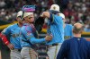 Milwaukee Brewers catcher William Contreras, left, consoles his pitcher Brandon Woodruff, right, before being taken out due to an injury in the fourth inning against the Arizona Diamondbacks Saturday, July 4, 2026, in Phoenix. (AP Photo/Darryl Webb)