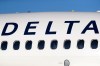 FILE - In this June 26, 2019, file photo, the company logo graces the side of a Delta Air Lines jetliner at Denver International Airport in Denver. (AP Photo/David Zalubowski, File)
