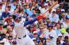 Chicago Cubs' Nico Hoerner hits an RBI single during the first inning of a baseball game against the St. Louis Cardinals, Sunday, July 5, 2026, in Chicago. (AP Photo/Melissa Tamez)