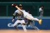 Pittsburgh Pirates shortstop Konnor Griffin, front, makes a diving catch on a popup hit by Washington Nationals' Keibert Ruiz for an out during the fourth inning of a baseball game, Sunday, July 5, 2026, in Washington. (AP Photo/Nick Wass)