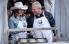 Alberta Premier Danielle Smith, and Ontario Premier Doug Ford cook pancakes at the annual Stampede breakfast in Calgary, Monday, July 7, 2025. THE CANADIAN PRESS/Jeff McIntosh