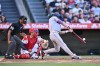 Boston Red Sox's Jarren Duran, right, hits a two-run home run during the second inning of a baseball game against the Los Angeles Angels, Sunday, July 5, 2026, in Anaheim, Calif. (AP Photo/William Liang)