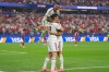 Spain's Pedro Porro, top, congrats Spain's Mikel Merino, right, after scored during the World Cup round of 16 soccer match between Portugal and Spain in Arlington, Texas, near Dallas, Monday, July 6, 2026. (AP Photo/Julio Cortez)