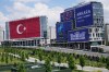 A Turkish flag and NATO banners cover buildings ahead of the NATO Summit in Ankara, Turkey, Monday, July 6, 2026. (AP Photo/Hussein Malla)