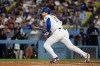 Los Angeles Dodgers' Shohei Ohtani runs after hitting a two-run single during the fourth inning of a baseball game against the Colorado Rockies in Los Angeles, Monday, July 6, 2026. (AP Photo/Kyusung Gong)