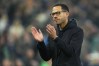 FILE - Chelsea's head coach Liam Rosenior applauds supporters after the English Premier League soccer match between Everton and Chelsea in Liverpool, England, Saturday, March 21, 2026. (AP Photo/Jon Super, File)