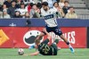 Vancouver Whitecaps' Brian White (24) and Portland Timbers' Finn Surman (20) vie for the ball during the first half of an MLS soccer match in Vancouver, on Saturday, April 4, 2026. THE CANADIAN PRESS/Ethan Cairns