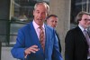 Britain's Reform UK leader Nigel Farage leaves Milbank Tower after he said he'll quit his Parliament seat and seek reelection in London, Tuesday, July 7, 2026.(AP Photo/Thomas Krych)