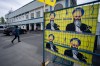 A person walks past signs of Hardeep Singh Nijjar at the Guru Nanak Sikh Gurdwara in Surrey, B.C. on Friday, May 3, 2024. THE CANADIAN PRESS/Ethan Cairns