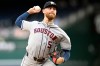 Houston Astros starting pitcher Mike Burrows throws during the first inning of a baseball game against the Washington Nationals, Monday, July 6, 2026, in Washington. (AP Photo/John McDonnell)