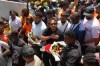 Members of Haiti’s national soccer team Martin Expérience, right center, and Josué Duverger receive flowers upon their arrival to the National Pantheon Museum in Port-au-Prince, Haiti, Tuesday, July 7, 2026, during a tour under heavy security to celebrate their participation in the World Cup. (AP Photo/Odelyn Joseph)