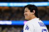 Los Angeles Dodgers' Shohei Ohtani smiles during the eleventh inning of a baseball game against the Colorado Rockies in Los Angeles, Monday, July 6, 2026. (AP Photo/Kyusung Gong)