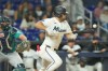 Miami Marlins' Jakob Marsee bunts the ball during the eighth inning of a baseball game against the Seattle Mariners Tuesday, July 7, 2026, in Miami. (AP Photo/Marta Lavandier)