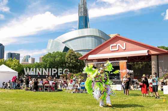 Malaki Kennedy from Sayisi Dene First Nation participates in men's fancy dance during the Wáhkóhtowin Powwow. (Brook Jones / Free Press)