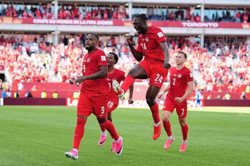 Canada's Cyle Larin (9) celebrates after scoring his sides first goal of the game with Promise David (24) in the second half of the World Cup Group B soccer match between Canada and Bosnia, Friday, June 12, 2026, in Toronto. ( (AP Photo/Sam Balkansky)