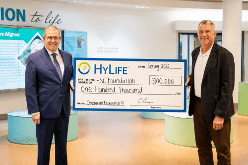 HyLife representatives present a $100,000 donation cheque to the HSC Foundation in support of Operation Excellence at a healthcare facility.