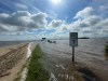 Flooding overtook Provincial Road 323 at Highway 7 Wednesday, with a sinkhole about half a kilometre away. (Ruth Bonneville / Free Press)