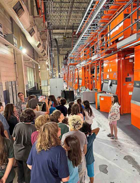 Students see the wonderous machines that turn out the print edition every evening. (Free Press)