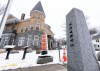 The border marker is seen beside the Haskell Free Library and Opera House in Stanstead, Que., on Friday, March 21, 2025. THE CANADIAN PRESS/Christinne Muschi