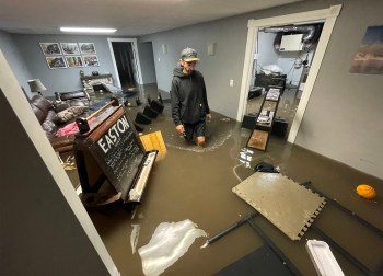 RUTH BONNEVILLE / FREE PRESS

BLAIR MOLLBERG -  homeowner in Balmoral wading through basement sewer water 

June 10, 2026