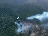 A helicopter buckets the Brunswick Creek wildfire north of Boston Bar, as shown in this handout photo provided by BC Wildfire Service, on Friday July 3, 2026. THE CANADIAN PRESS/Handout-BC Wildfire Service
(Mandatory Credit)