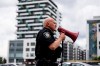 A Montreal police officer clears an area at the scene of a shooting in Montreal on Monday, June 22, 2026. THE CANADIAN PRESS/Christopher Katsarov