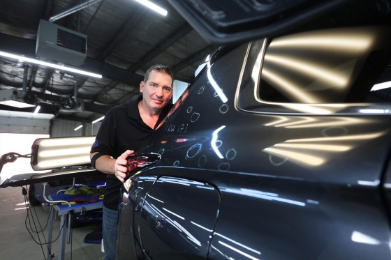 Trevor Sprechert, general manager of Dr. Dent on St. James Street, said they have been inundated with more hail claims than he has ever seen before. (Ruth Bonneville / Free Press)