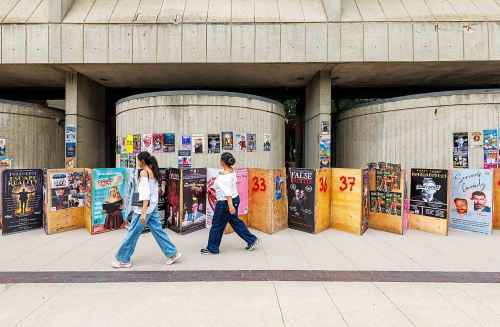 MIKE DEAL / FREE PRESS
Fringe festival posters and sandwich boards line the sidewalk along Market Avenue beside the Royal Manitoba Theatre Centre.