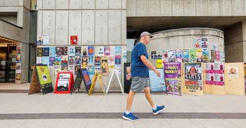 MIKE DEAL / FREE PRESS
Fringe Festival posters and sandwich boards line the sidewalk along Market Avenue beside the Royal Manitoba Theatre Centre.