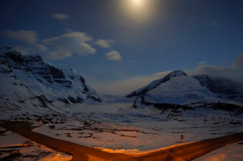 The Athabasca Glacier, centre, part of the Columbia Icefields in Jasper National Park, Alta., is seen in moonlight on May 7, 2014. THE CANADIAN PRESS/Jeff McIntosh