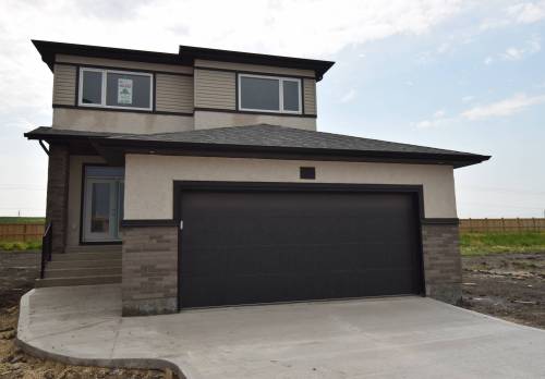TODD LEWYS / FREE PRESS
                                The 1,910 sq. ft, two-storey Florence is one flexible, fashionable and value-packed family home.