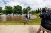 MIKE DEAL / FREE PRESS
                                Swan River Mayor Lance Jacobson in front of the town&rsquo;s flooded Jack Brown Memorial Field Thursday.