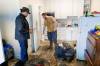 MIKE DEAL / FREE PRESS
                                Manitoba Premier Wab Kinew meets David McRae as he cleans out his apartment between shifts.