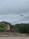 RICHARD SUIDAK PHOTO
                                A helicopter can be seen looking over a section of CN Rail line that was damaged by flooding in the Parkland region on Tuesday.