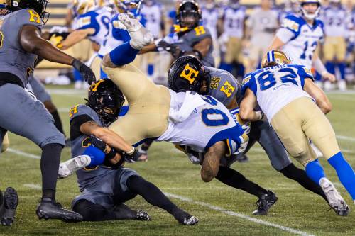 Nick Iwanyshyn / THE CANADIAN PRESS
                                Winnipeg Blue Bombers running back Brady Oliveira (20) finished the game Sunday with 17 carries for 84 yards, including a 44-yard grind down the field to set up Sergio Castillo&rsquo;s game-winning field goal.