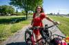 MIKAELA MACKENZIE / FREE PRESS Patty Wiens, bike mayor of Winnipeg, with her e-bike on the NorthEast Pioneers Greenway on Monday.