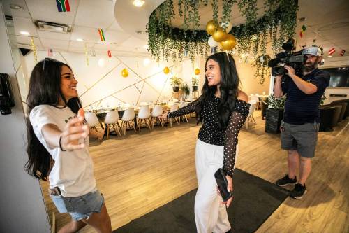 MIKAELA MACKENZIE / FREE PRESS
                                Arshdeep Virk, after school program teacher (right) hugs graduate Nur Othman at a graduation celebration dinner for newcomer youth, hosted by IRCOM at Zaytoon Restaurant, on Wednesday.