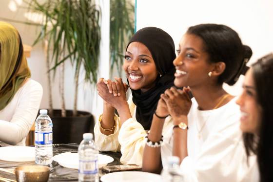 Mariam Wancha (centre) chats with fellow graduates at the graduation celebration dinner, Wednesday. (Mikaela MacKenzie / Free Press)