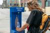BROOK JONES / FREE PRESS
                                Jaunie Young, 28, refills a plastic bottle of water at a City of Winnipeg hydration station on Princess Street, in Winnipeg where temperatures are expected to reach 37 degrees Celsius this weekend.