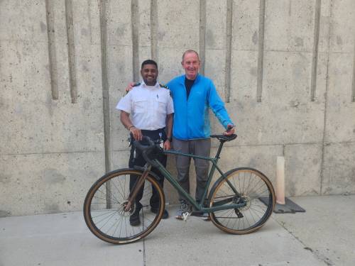Morgan Modjeski / Free Press
                                A Winnipeg Transit employee poses for a photo with Fergus Watt, 69, after two Transit employees were able to help him get his bike back. The pedal-powered two wheeler was stolen on Tuesday, but would be confiscated by a Winnipeg Transit employee and eventually resulted in its return Friday afternoon.